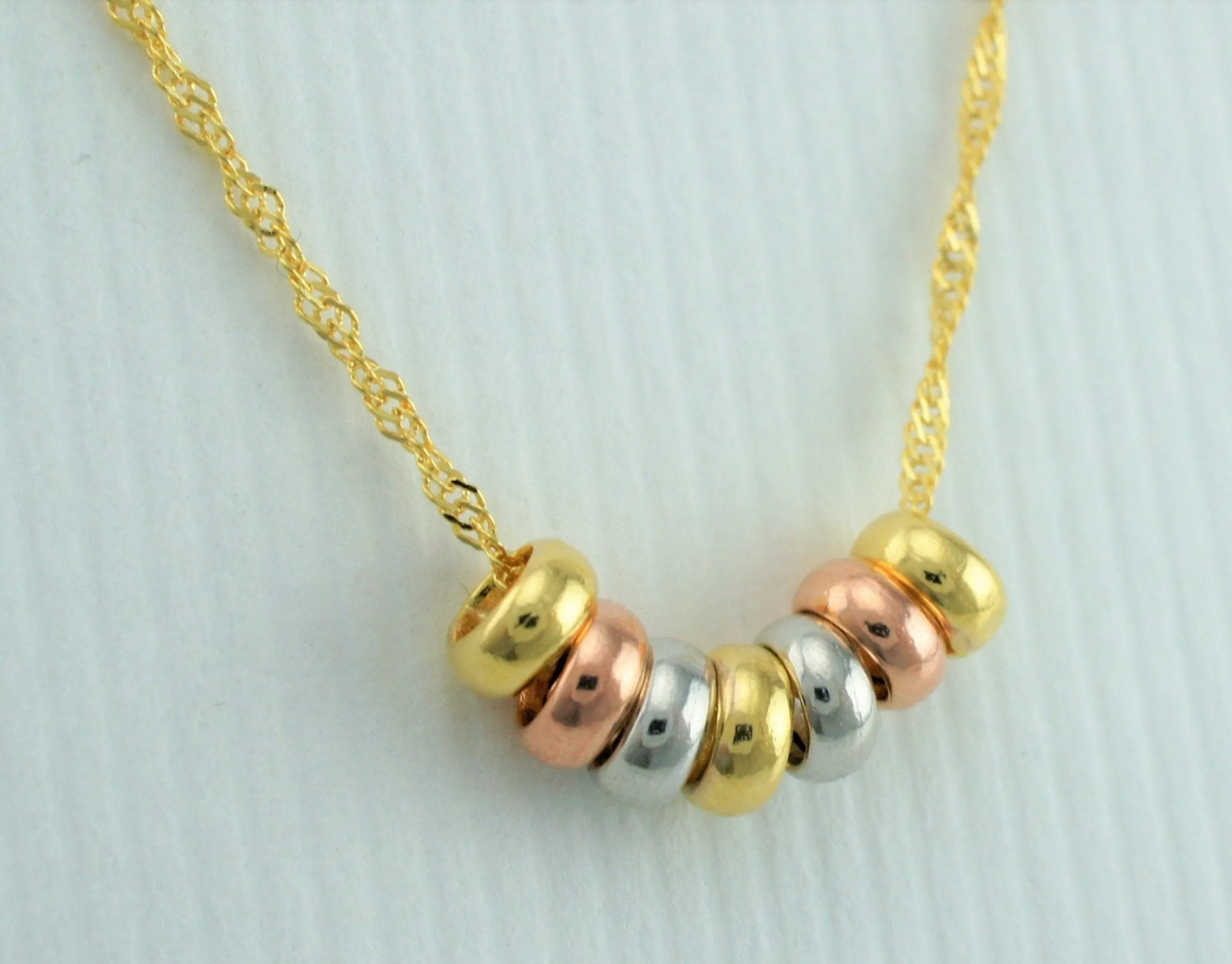 9ct Gold Yellow, White & Rose Gold 7 Mini Lucky Rings Pendant Necklace